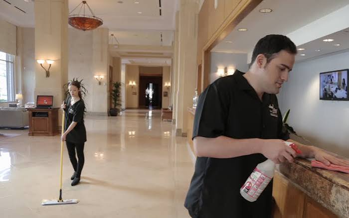 Housekeeping staff cleaning a lobby